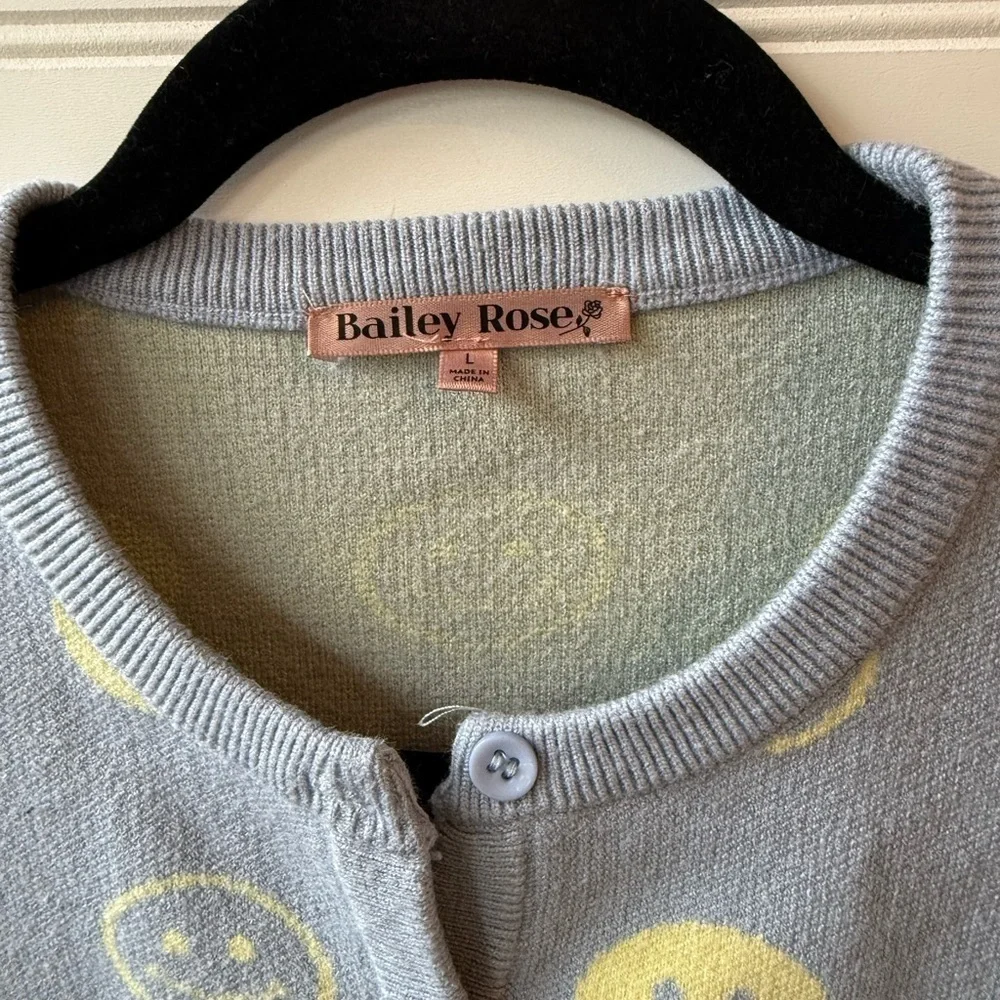 Bailey Rose cropped preppy smiley face sweater. Juniors size large.